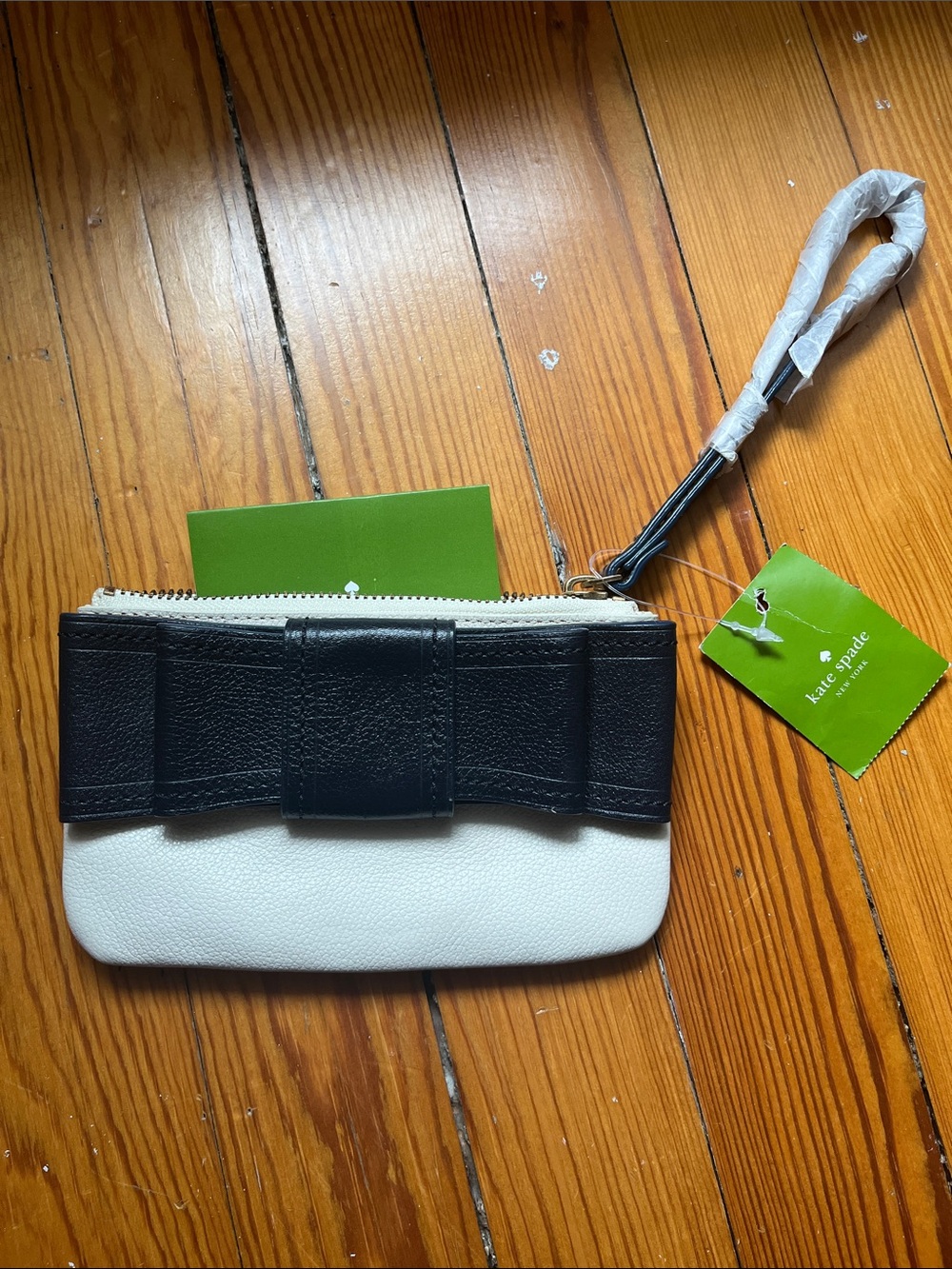 kate spade white and black bow wristlet pouch with strap